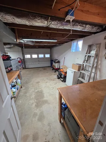 a view of a garage with a bike and car