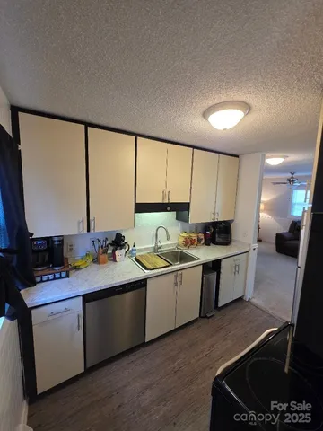 a living room with furniture and a lamp