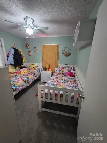 a bedroom with bed and window