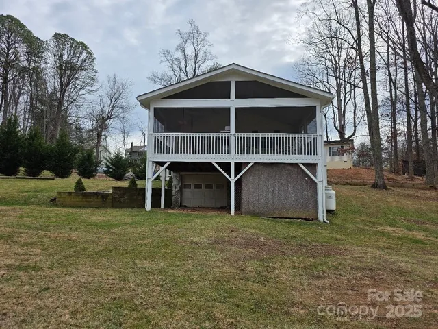 a view of a wooden chairs next to a yard