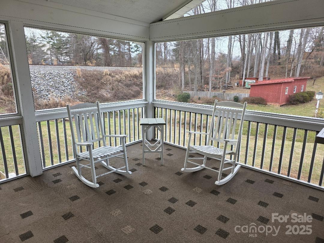 26 Azalea Road Arden, NC 28704 - Photo 7 of 26 a view of a wooden chairs next to a yard