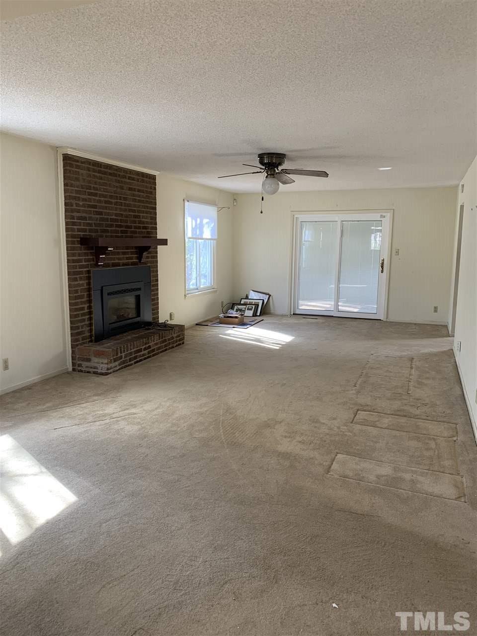 6910 Blalock Road Bahama, NC 27503 - Photo 4 of 13 Fireplace with gas insert.