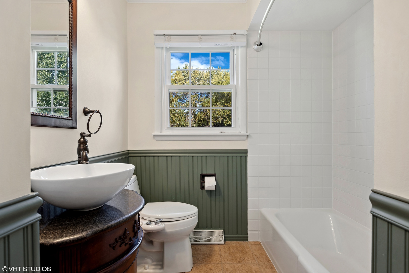 106 Lloyd Street Cary, IL 60013 - Photo 11 of 14 a bathroom with a toilet sink and mirror