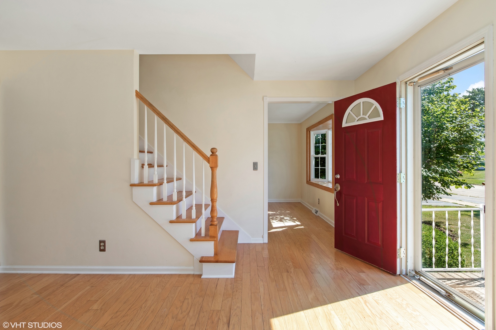 106 Lloyd Street Cary, IL 60013 - Photo 3 of 14 a view interior of a house with wooden floor windows and stairs