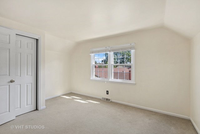 106 Lloyd Street Cary, IL 60013 - Photo 10 of 14 an empty room with windows