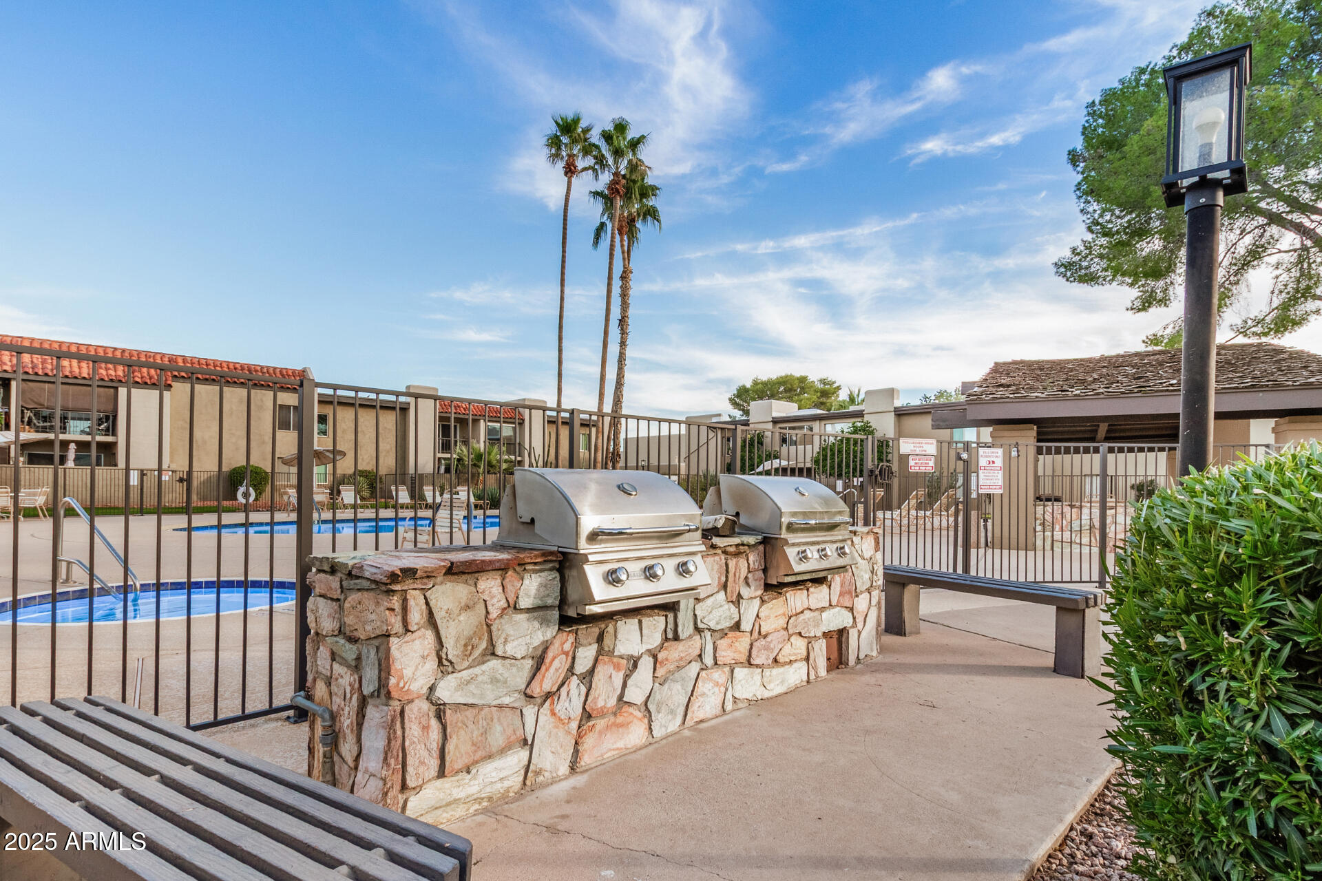 4201 East Camelback Road, Unit 15 Phoenix, AZ 85018 - Photo 27 of 32 a view of a terrace with sitting area