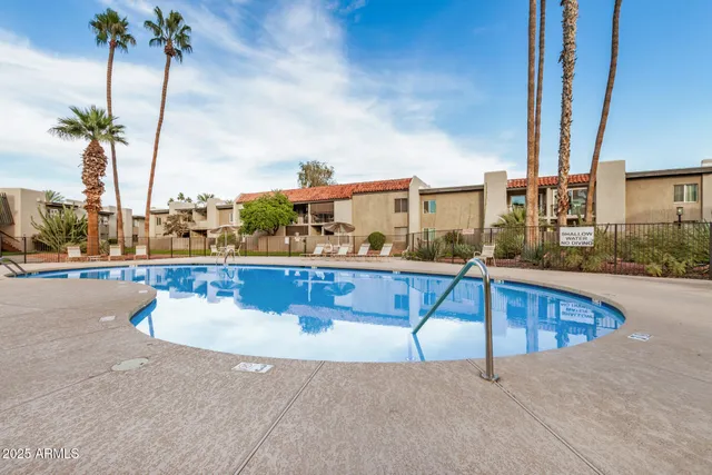 a view of swimming pool with outdoor seating