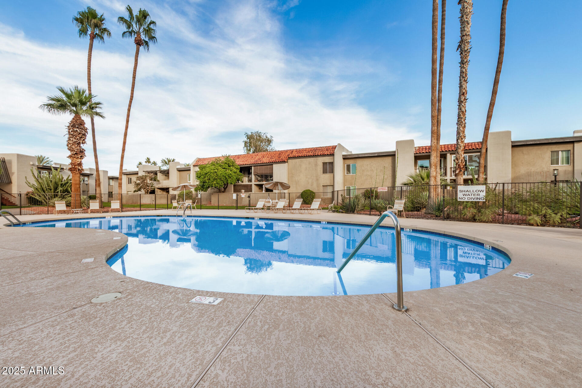4201 East Camelback Road, Unit 15 Phoenix, AZ 85018 - Photo 30 of 32 a view of swimming pool with outdoor seating