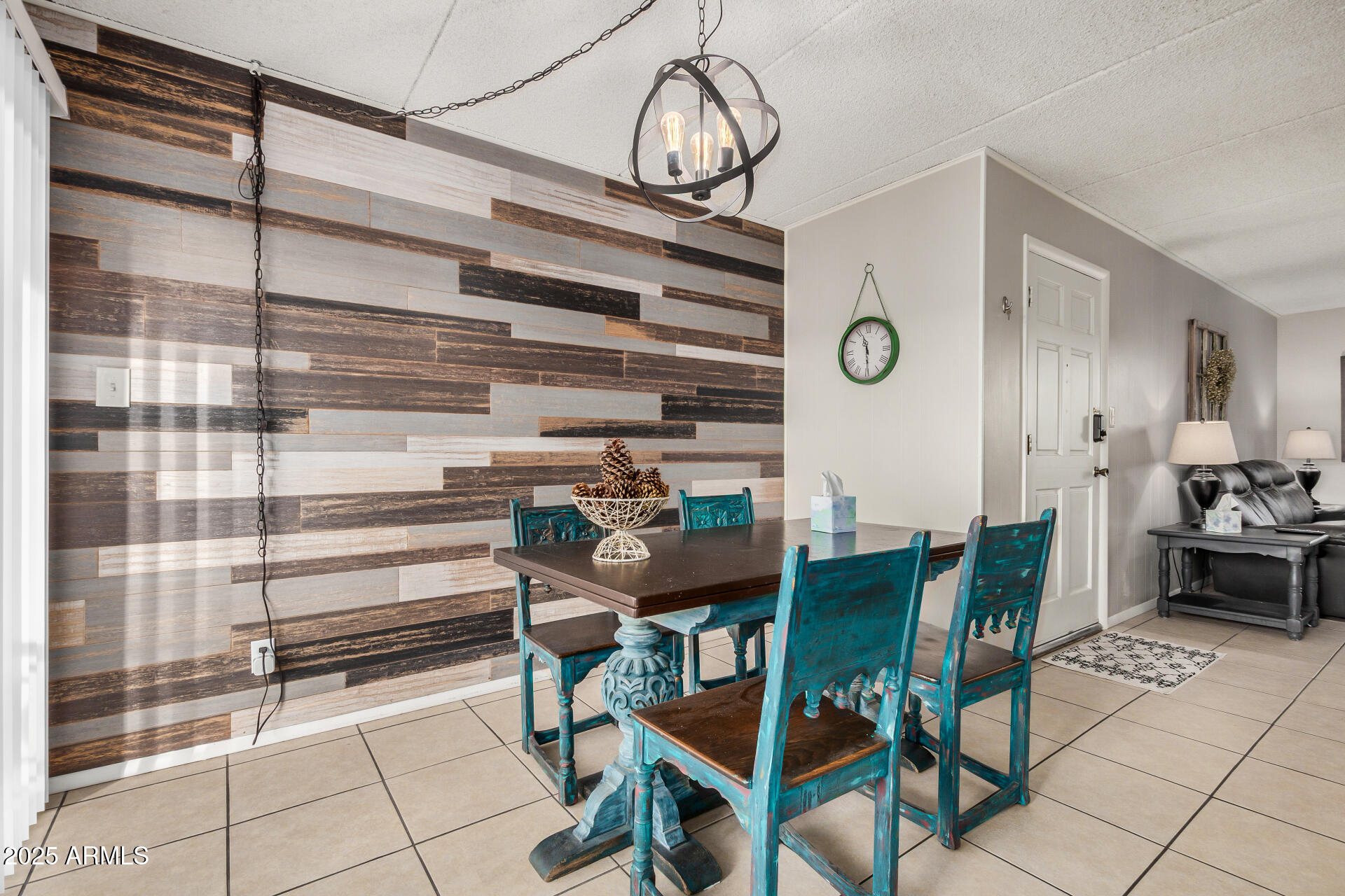 4201 East Camelback Road, Unit 15 Phoenix, AZ 85018 - Photo 8 of 32 a view of a dining room with furniture and a chandelier