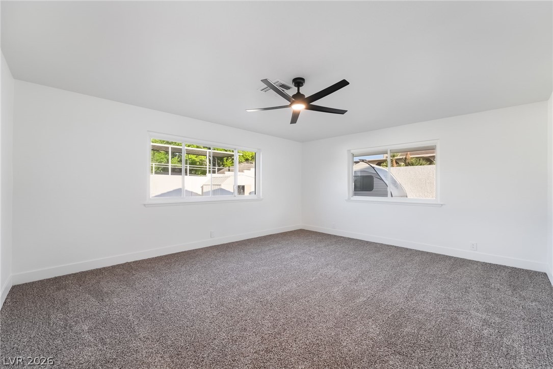 429 Crestway Road Henderson, NV 89015 - Photo 26 of 56 Well-lit room offering plush carpeting and ample natural light through large windows.
