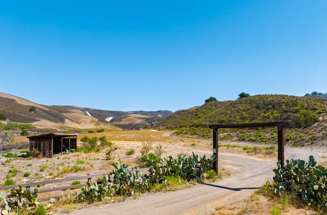 a view of a mountain with an ocean view