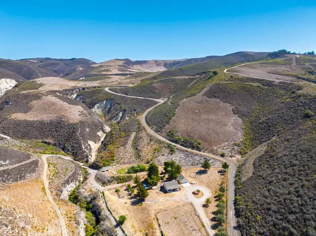 a view of a backyard of a house