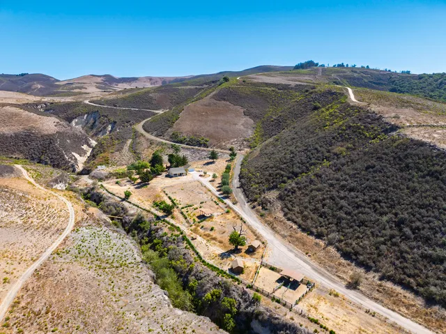 a view of a city with mountains in the background