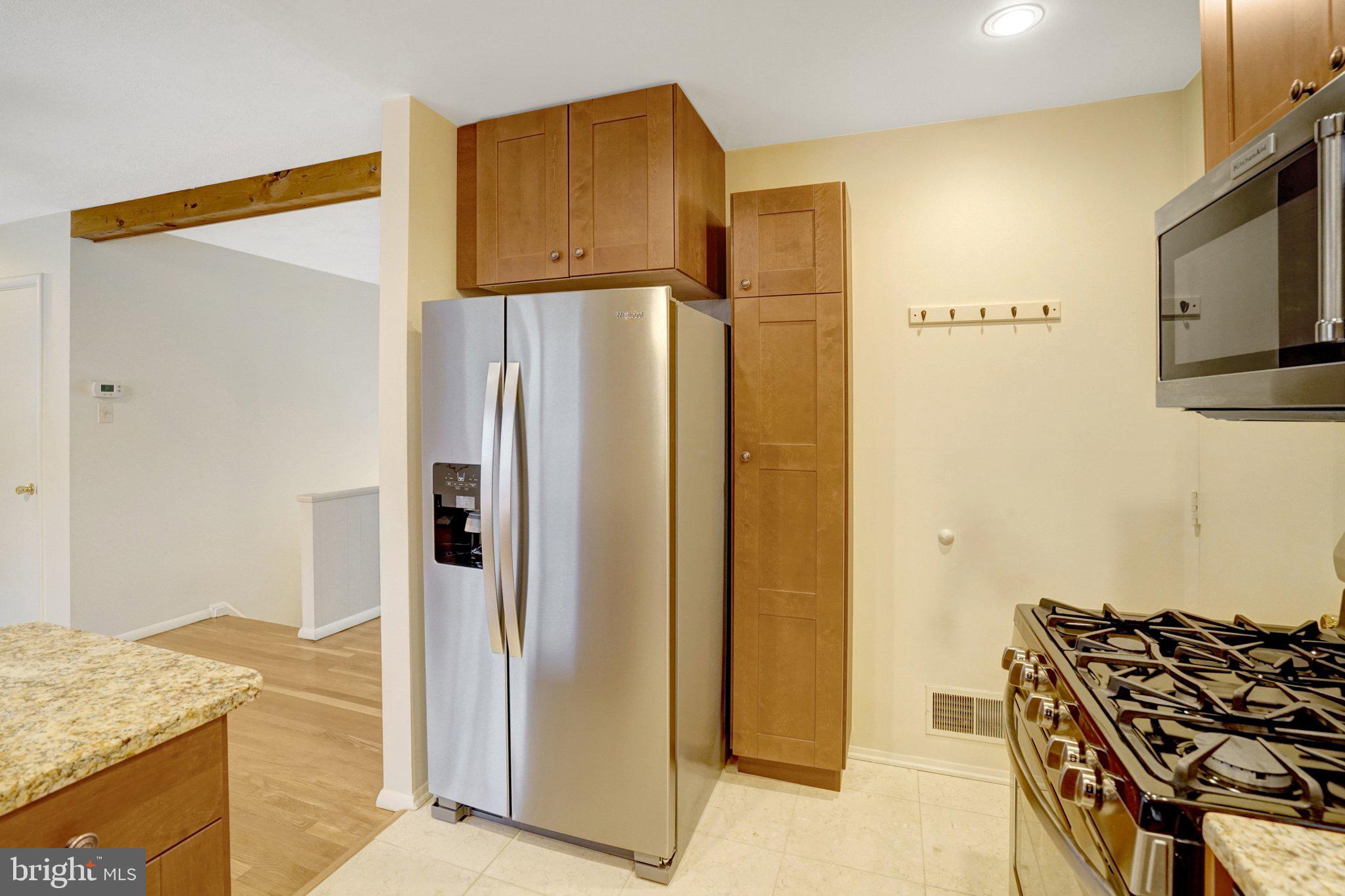 5417 Juliet Street Springfield, VA 22151 - Photo 14 of 46 a kitchen with a refrigerator and a stove top oven