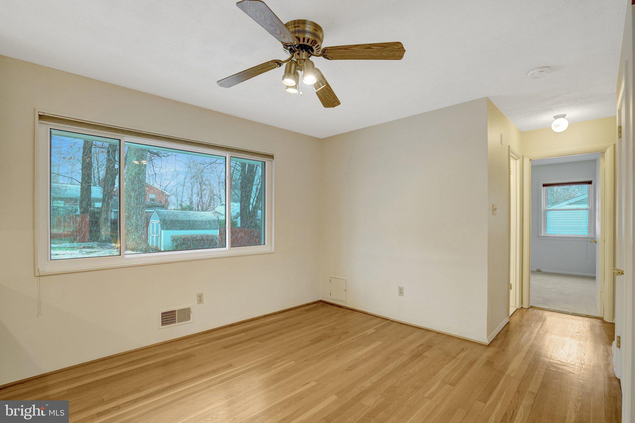 5417 Juliet Street Springfield, VA 22151 - Photo 15 of 46 a view of an empty room with window and wooden floor