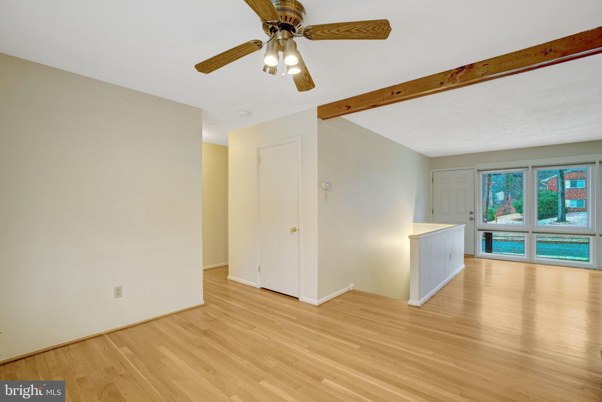 5417 Juliet Street Springfield, VA 22151 - Photo 26 of 46 a view of empty room with wooden floor and fan