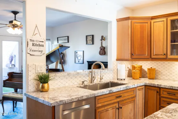 a view of a kitchen area with furniture and a window