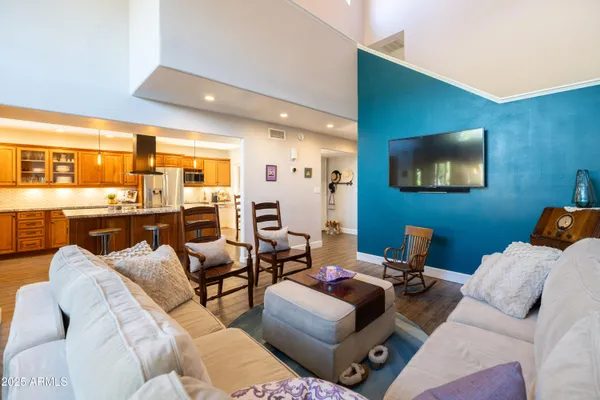 a bathroom with a granite countertop sink a toilet and mirror