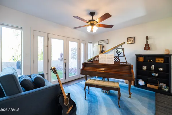 a living room with furniture and a large window