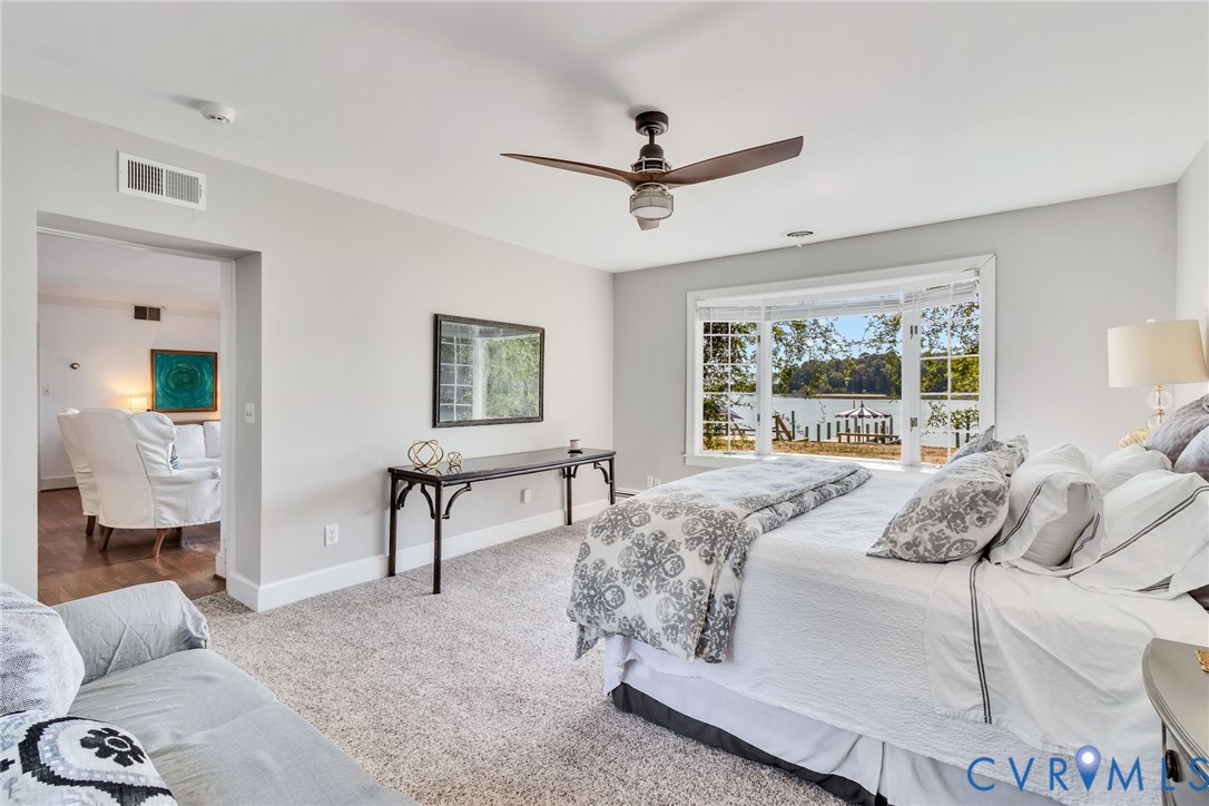430 Harveys Neck Road Heathsville, VA 22473 - Photo 29 of 51 Light gray wall paint, textured carpeting, bay win