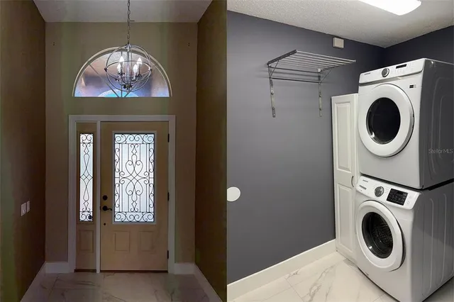 a view of a hallway with washer and dryer