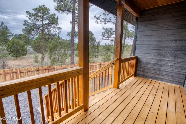a view of a balcony with wooden floor