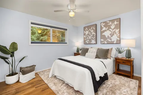 a bedroom with bed and a window