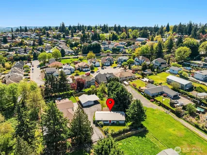 an aerial view of residential houses with outdoor space