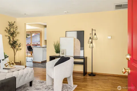 a living room with furniture and a table