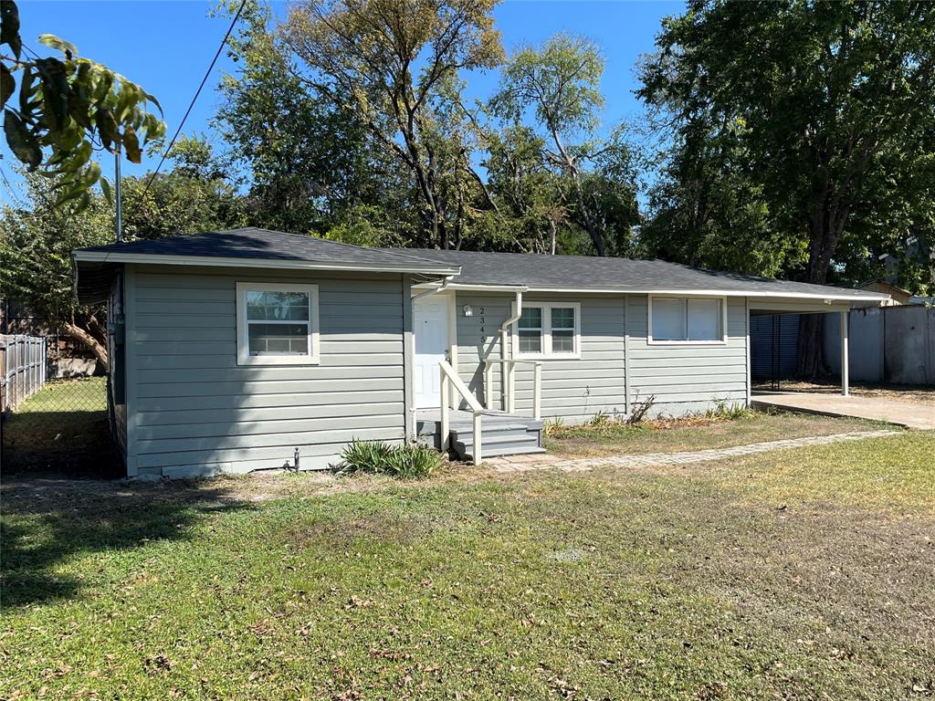 a house view with a backyard space