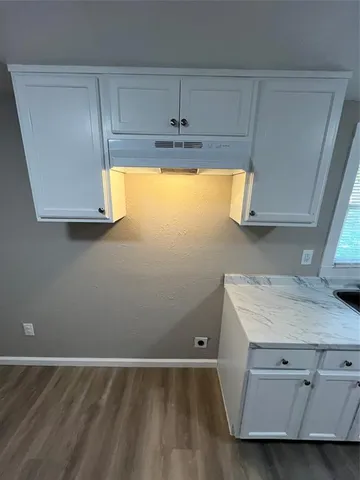 a view of a kitchen with a sink and dishwasher