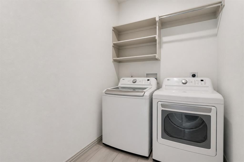 8913 Swallowtail Street Frisco, TX 75035 - Photo 23 of 38 a utility room with dryer and washer