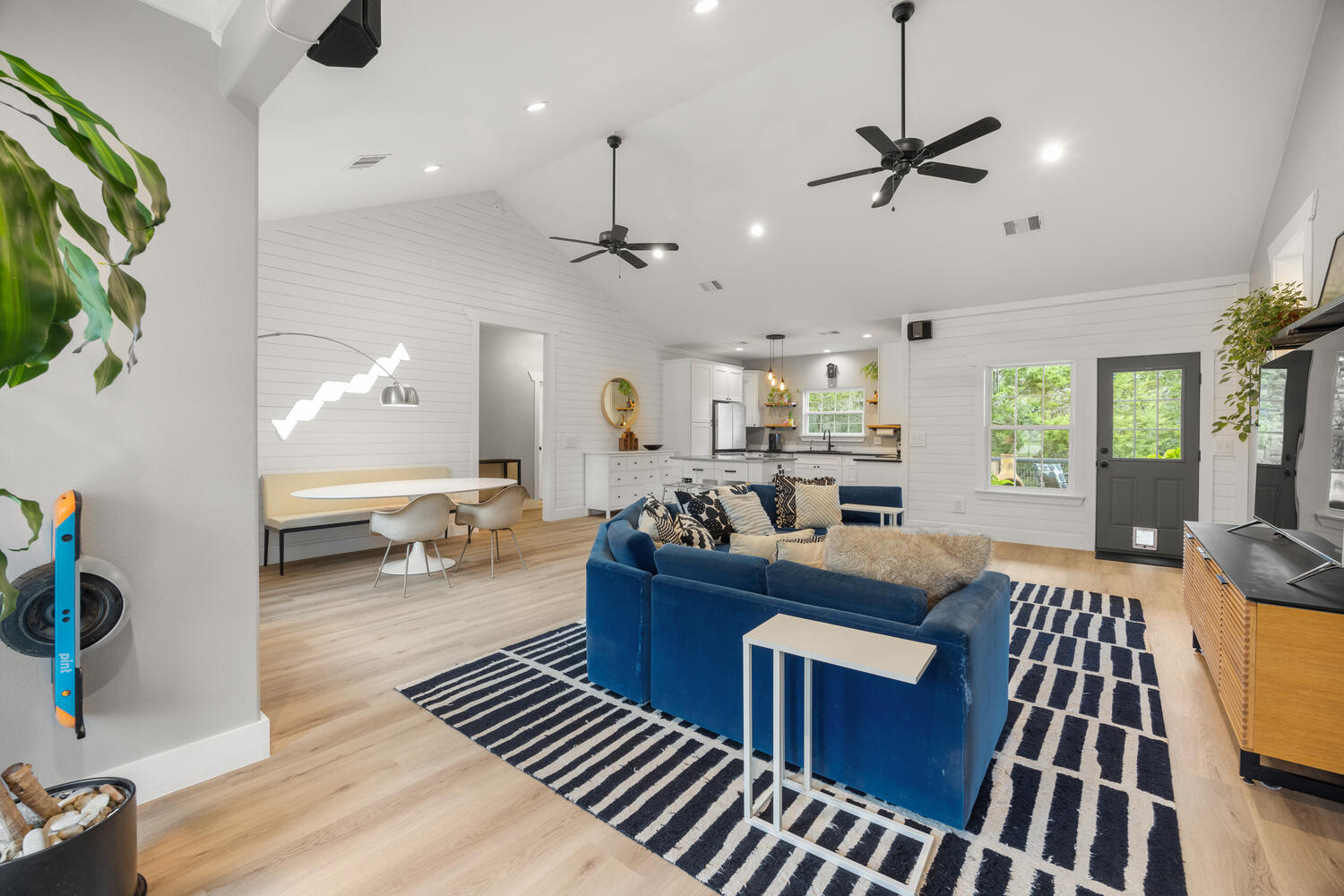 8 Butterfly Street Wimberley, TX 78676 - Photo 2 of 27 Living room with a high ceiling, light wood finished floors, a ceiling fan, and recessed lighting