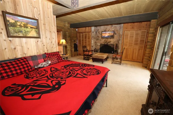 a bedroom with a bed and window