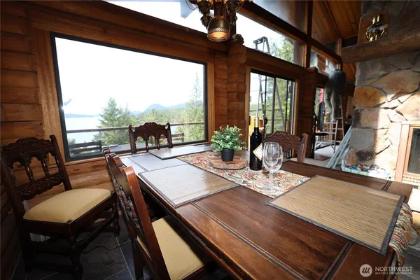 a view of a dining room with furniture window and outside view