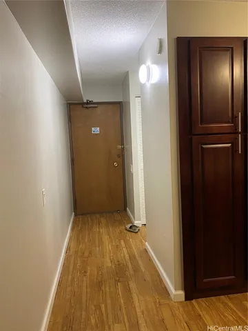 a view of gallery with wooden floor