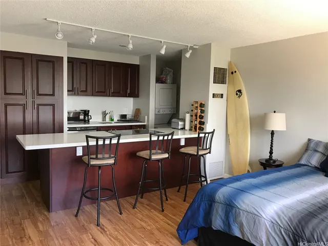 a bed room with a bed and chair