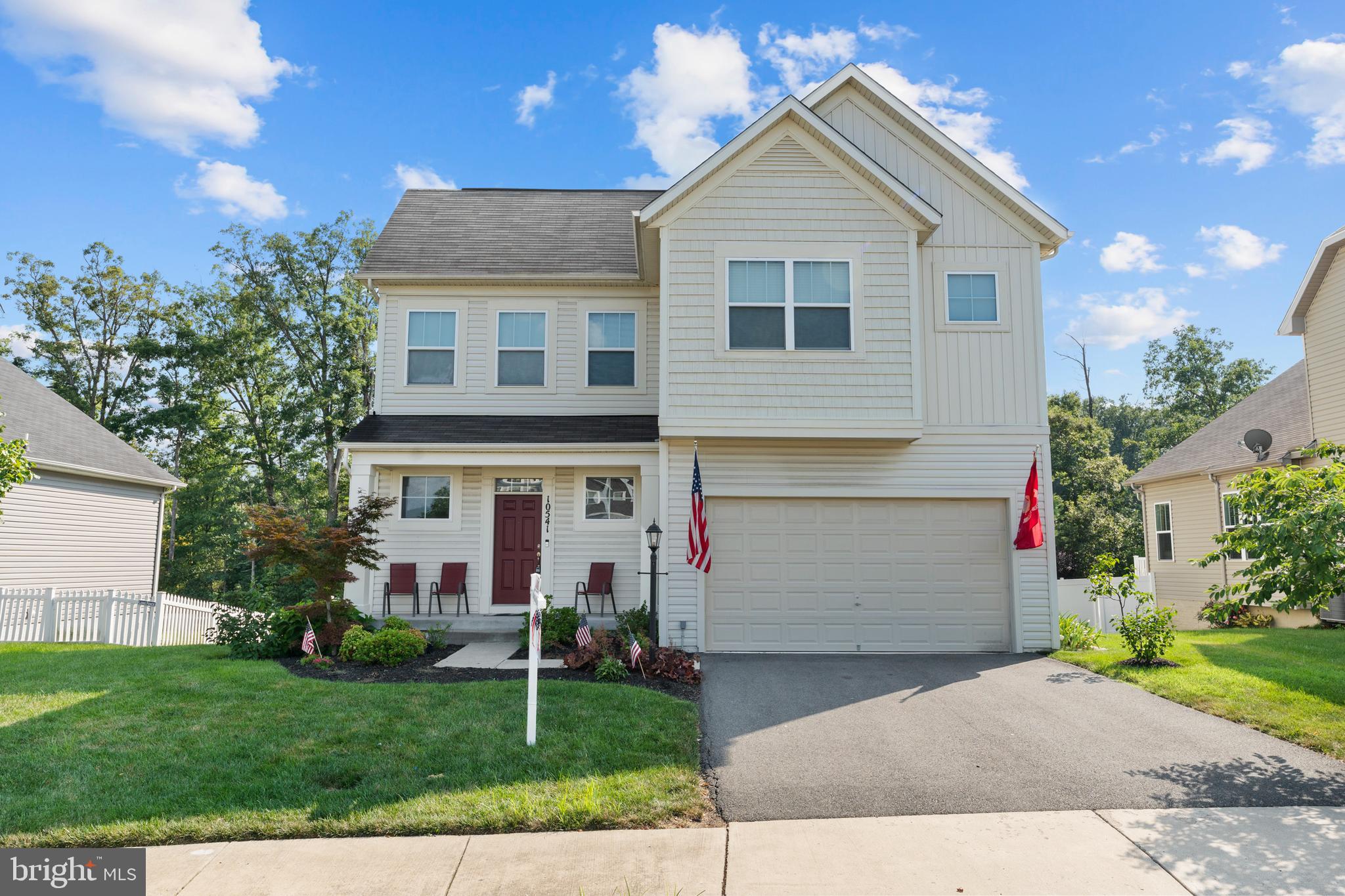 10541 Blazing Star Loop Bristow, VA 20136 - Photo 1 of 41 a view of a yard in front of a house