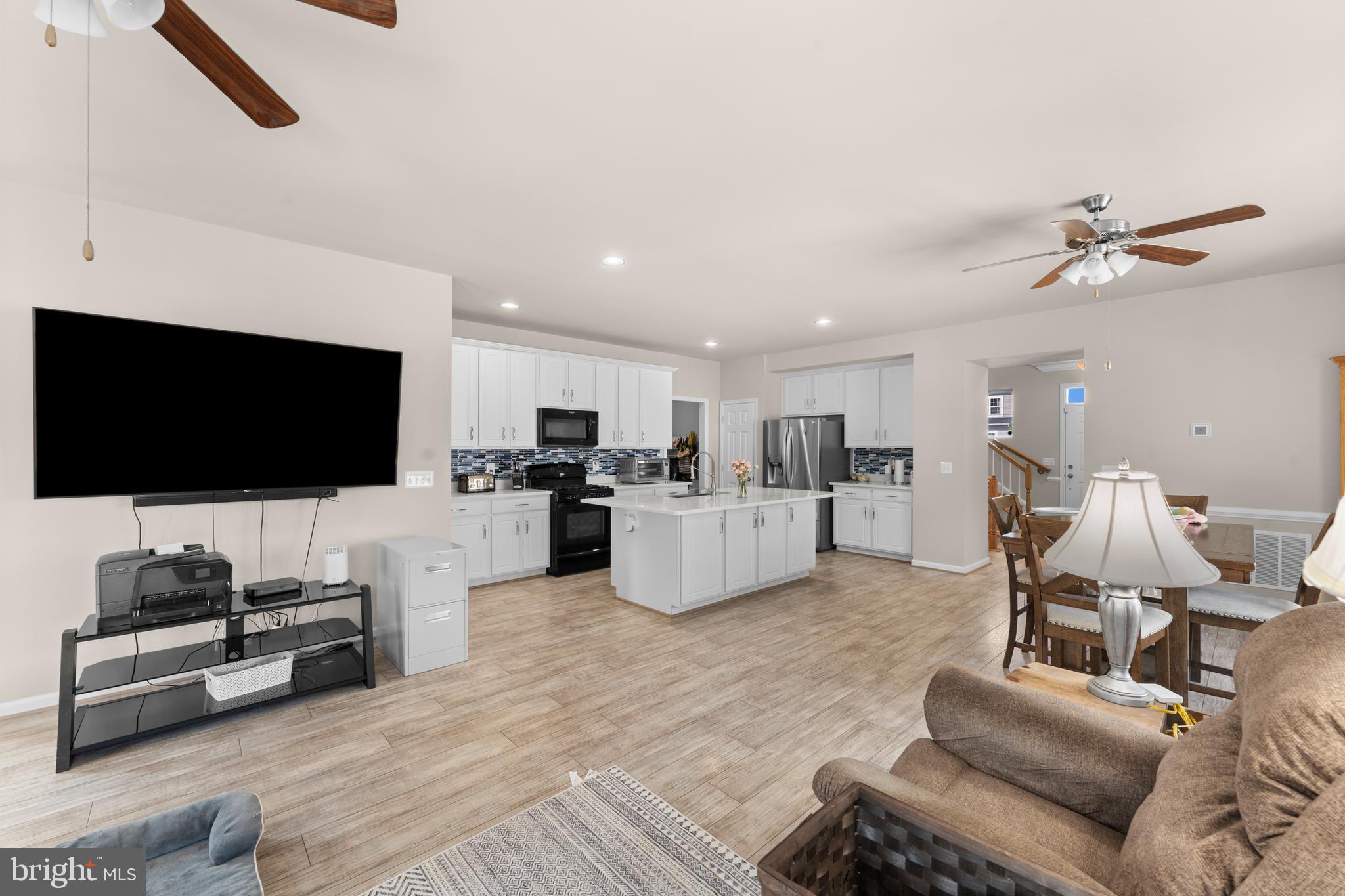 10541 Blazing Star Loop Bristow, VA 20136 - Photo 11 of 41 a living room with furniture and a flat screen tv