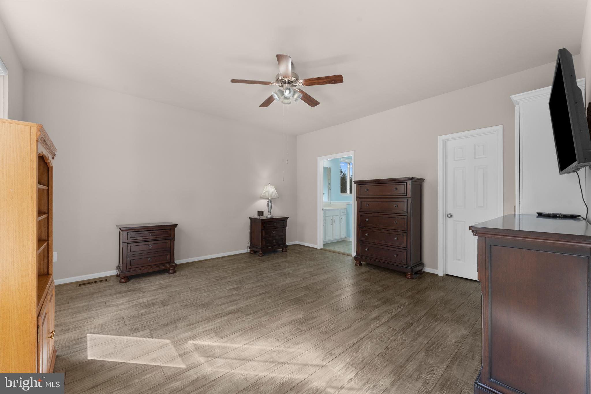 10541 Blazing Star Loop Bristow, VA 20136 - Photo 16 of 41 a view of an empty room with a kitchen