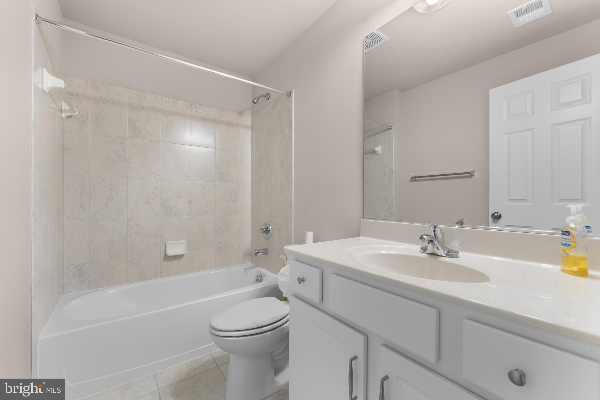 10541 Blazing Star Loop Bristow, VA 20136 - Photo 33 of 41 a bathroom with a sink a toilet and shower