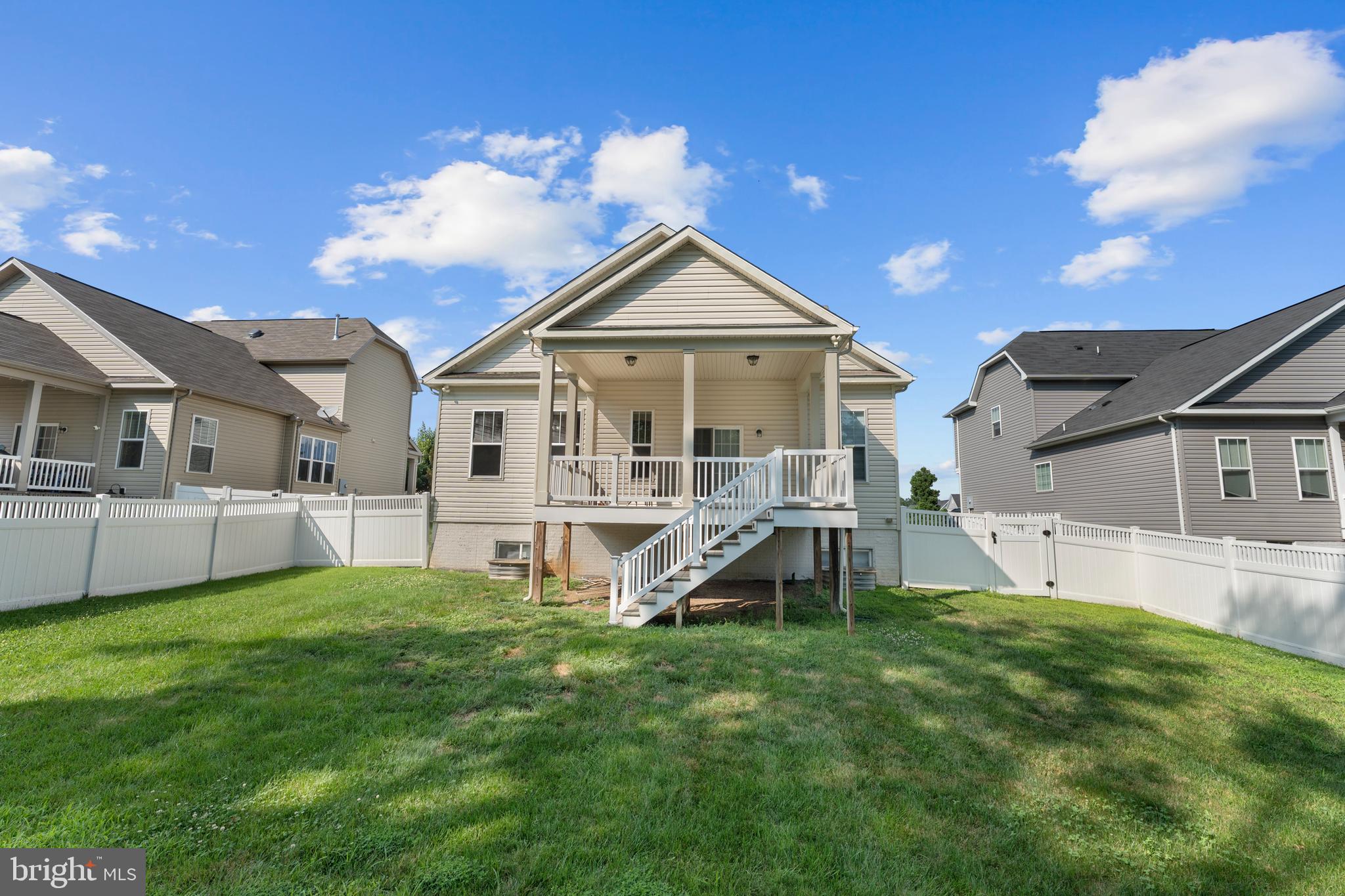 10541 Blazing Star Loop Bristow, VA 20136 - Photo 35 of 41 a view of a house with a yard and sitting area