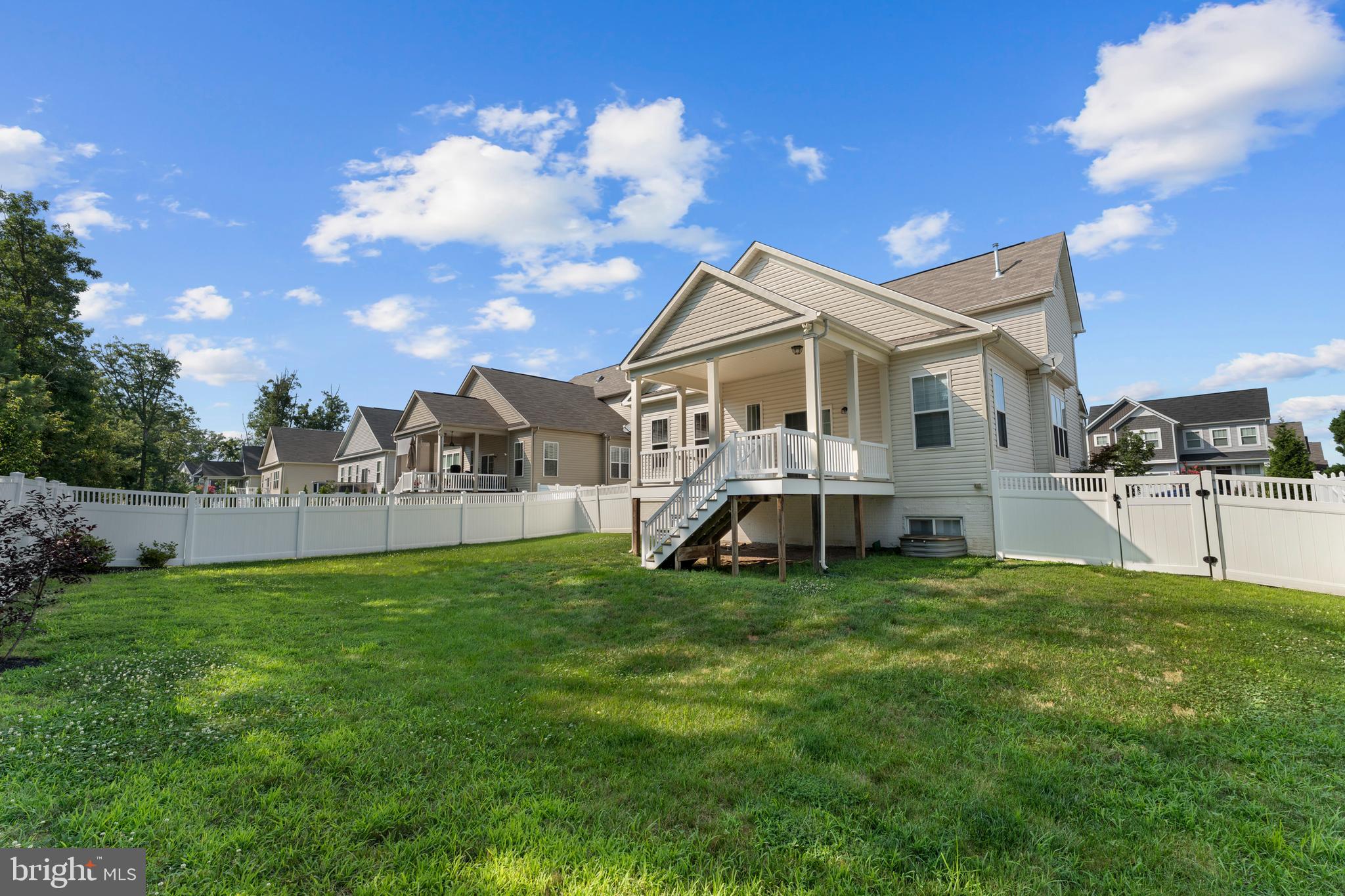 10541 Blazing Star Loop Bristow, VA 20136 - Photo 36 of 41 a view of a house with a yard and sitting area