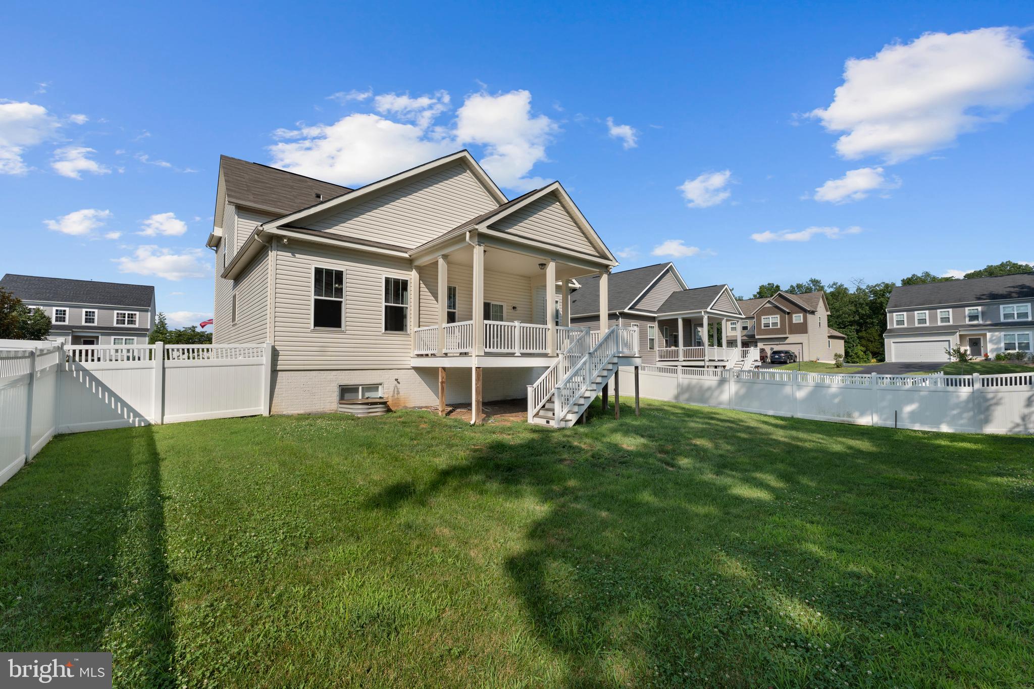 10541 Blazing Star Loop Bristow, VA 20136 - Photo 37 of 41 a house that has a big yard with potted plants