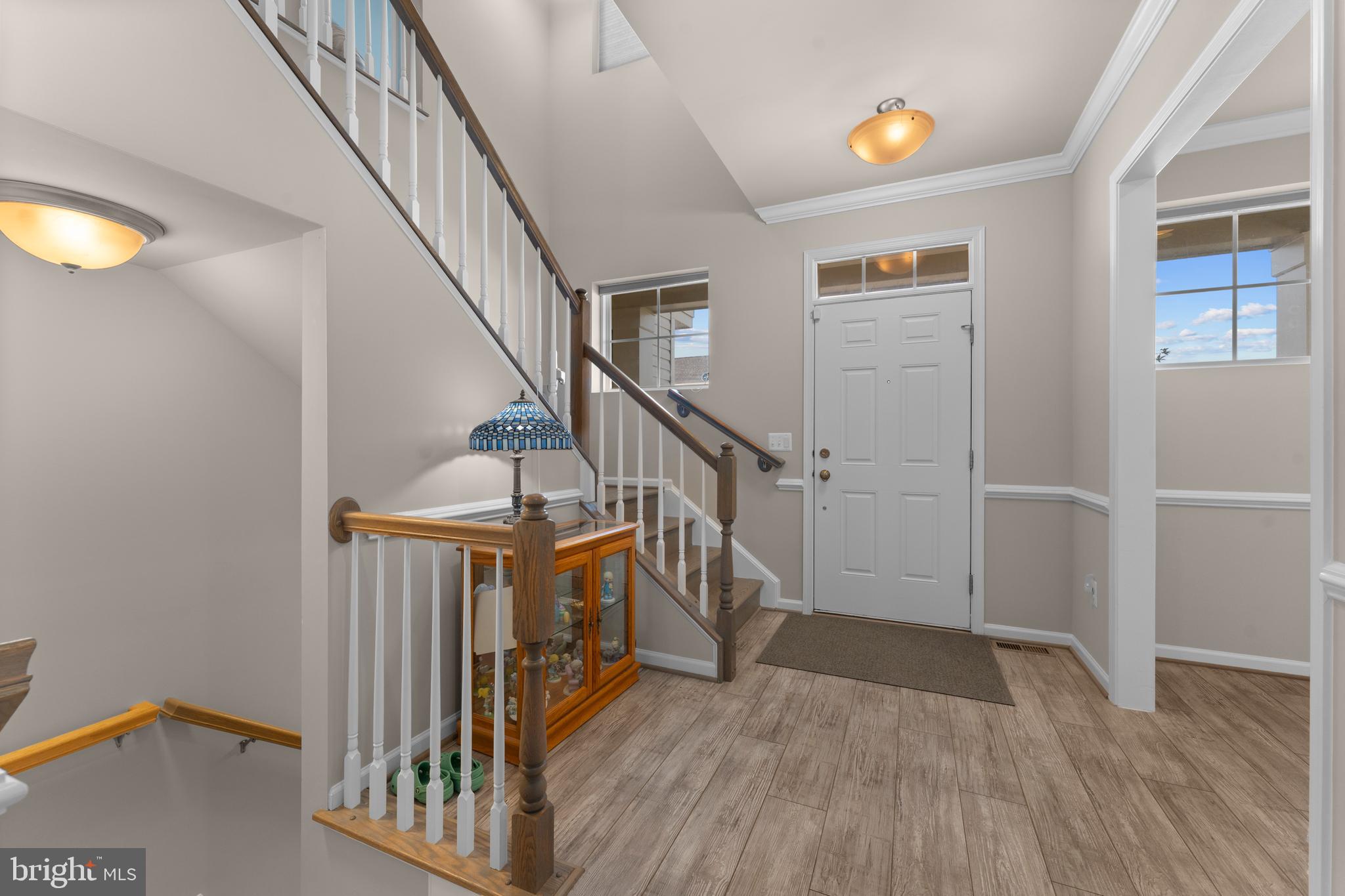 10541 Blazing Star Loop Bristow, VA 20136 - Photo 6 of 41 a view of entryway with wooden floor and stairs