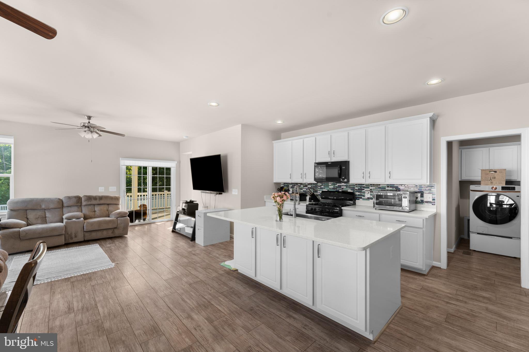 10541 Blazing Star Loop Bristow, VA 20136 - Photo 8 of 41 a kitchen with sink stove and refrigerator