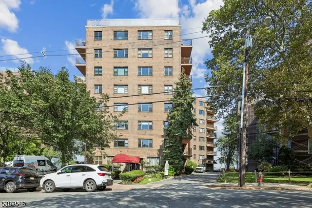 a view of a cars parked in front of a building