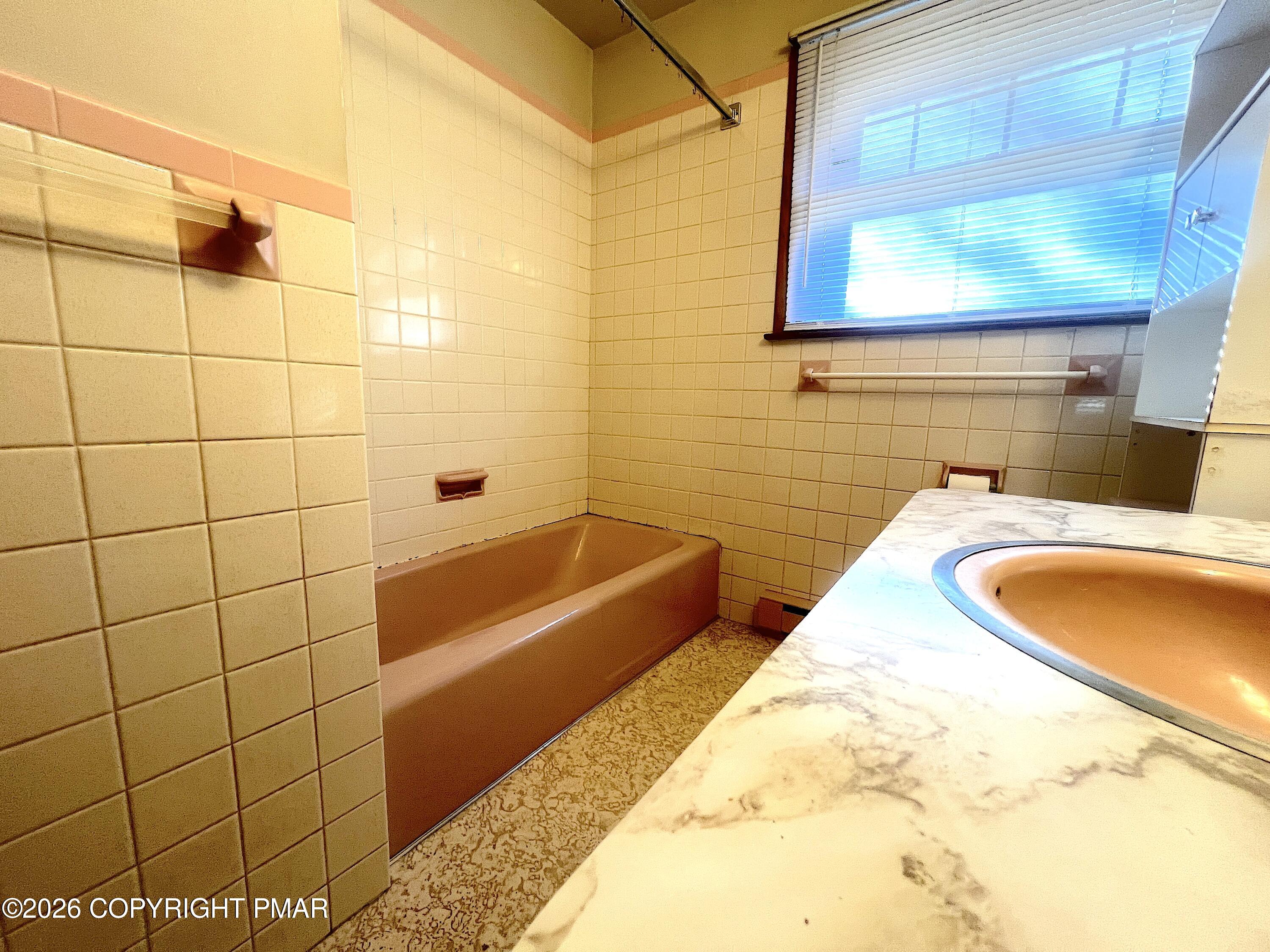 617 School Road Nazareth, PA 18064 - Photo 23 of 30 a bathroom with a tub a sink and a shower