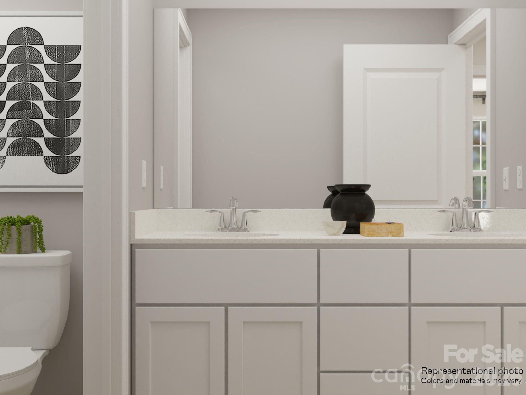 141 Spotted Way Troutman, NC 28166 - Photo 7 of 28 a bathroom with a sink and a toilet