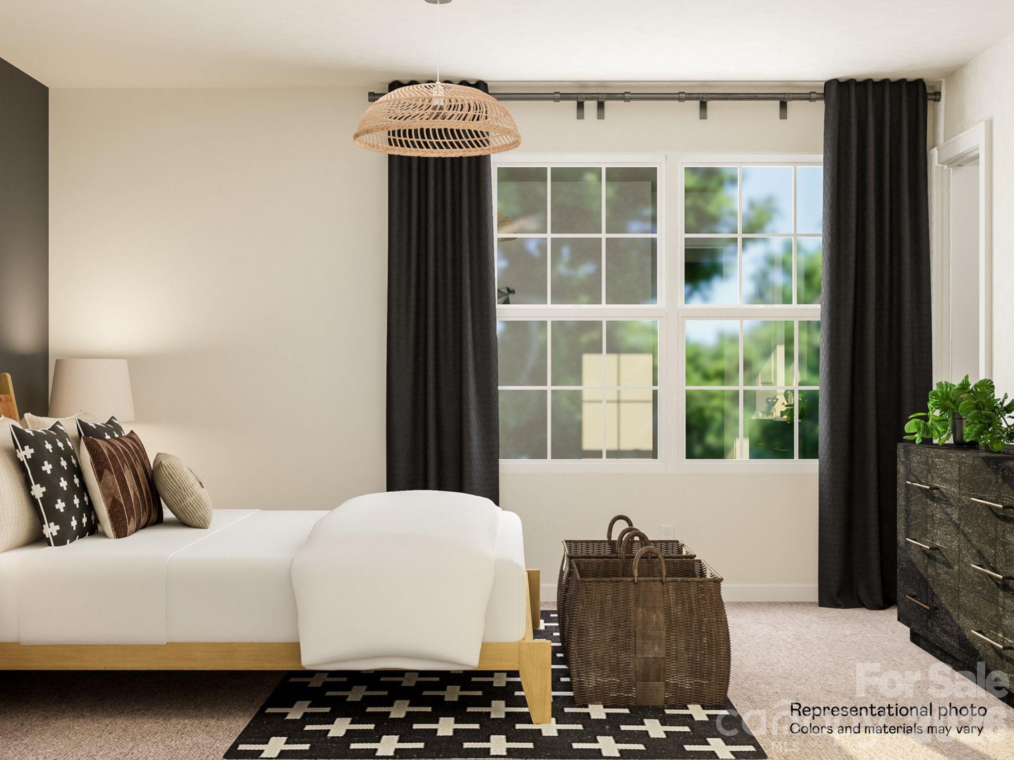 141 Spotted Way Troutman, NC 28166 - Photo 8 of 28 a bedroom with a bed and a window